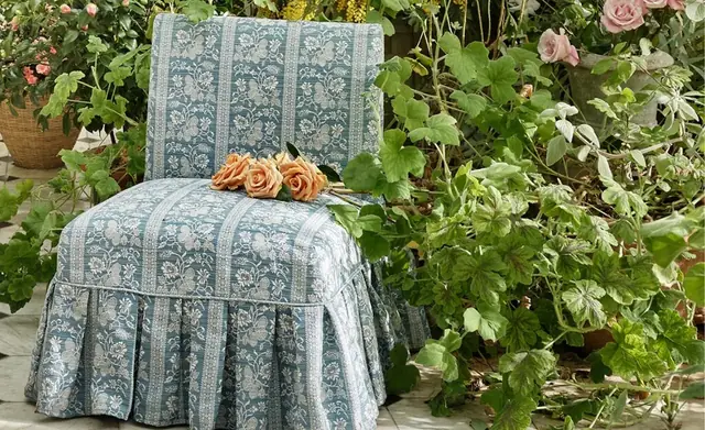 Zoffany indoor-outdoor fabric on a blue patterned garden chair