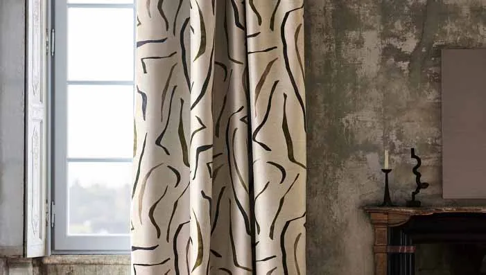 An image of jacquard fabric with intricate woven patterns, highlighting its rich texture and elegant design.