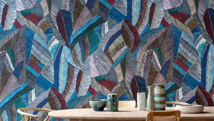 Cozy living room with textile wallpaper, adding warmth and texture to the walls.