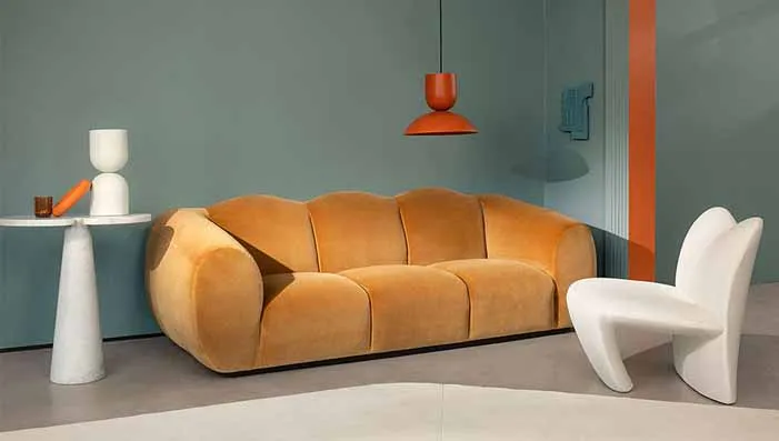 A plush velvet sofa in rich, warm tones, emphasizing the soft and luxurious texture of the velvet fabric.